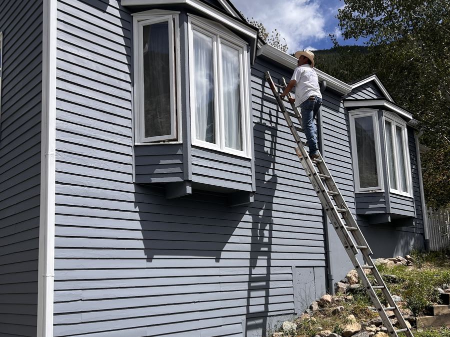 Same siding freshly painted with white trim