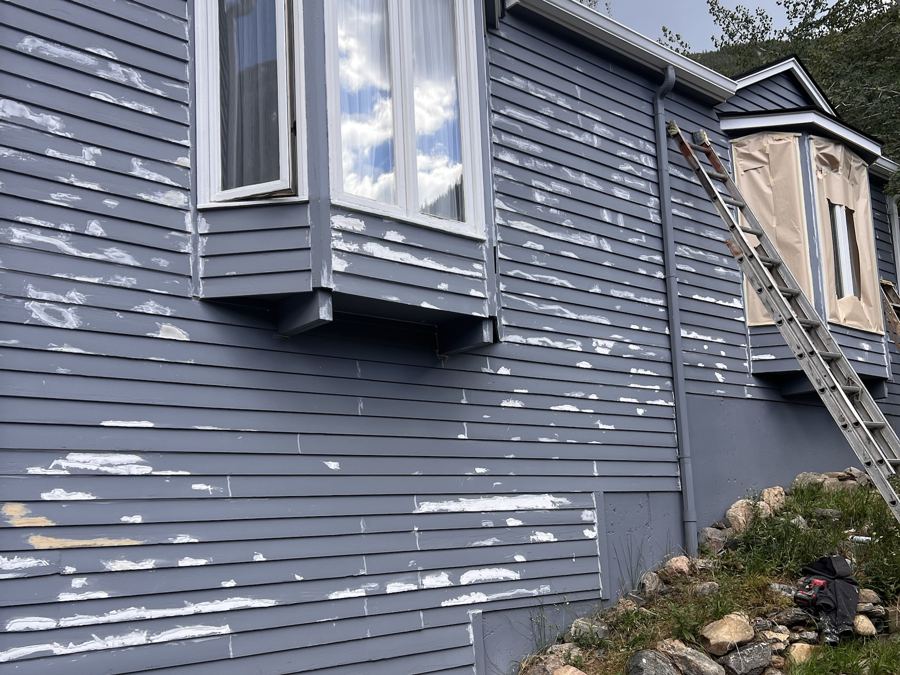 Siding patched and primed