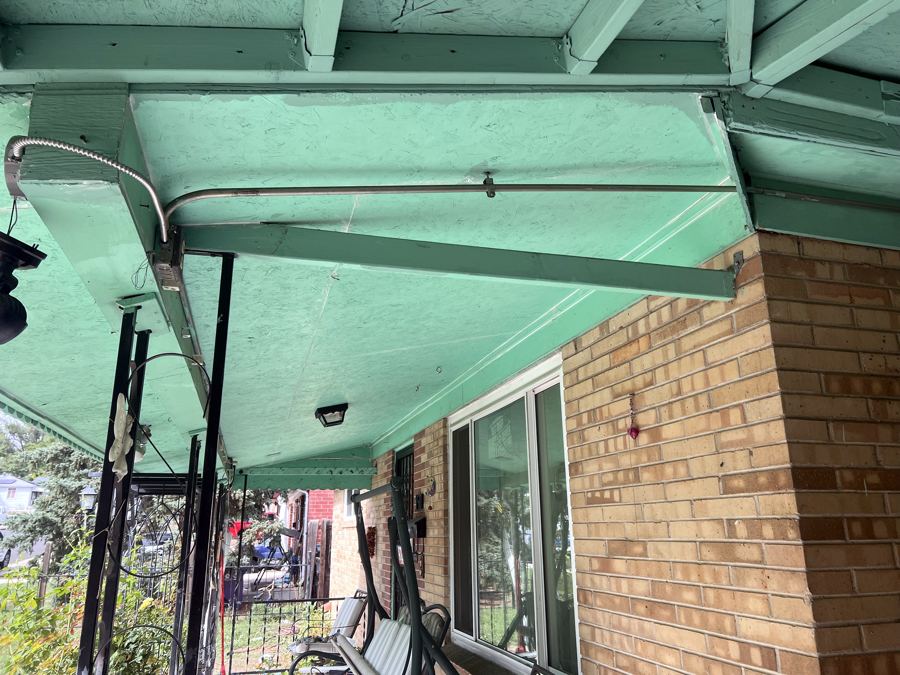 Porch ceiling before, worn mint green