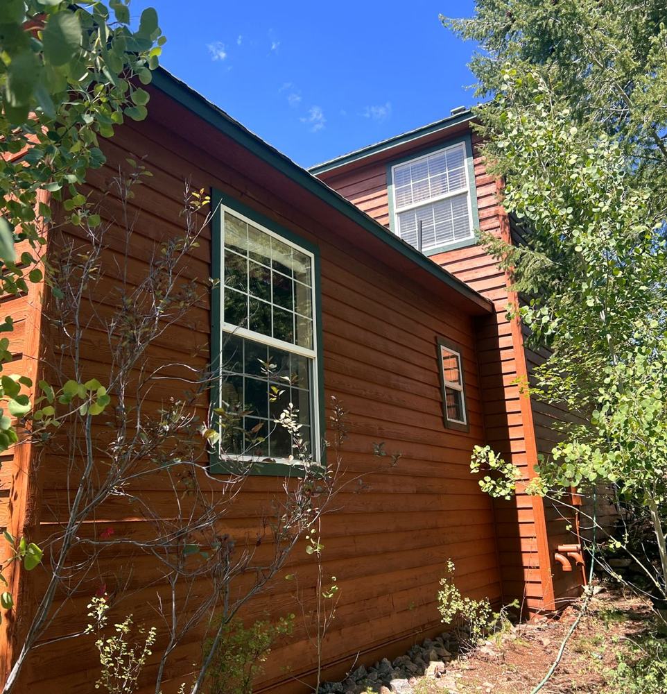Stained siding and trim on a mountain home